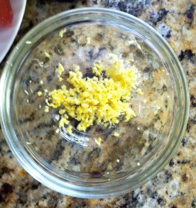 First, grate 3" of fresh ginger on a microplane. This will serve as the base of our vinaigrette dressing and our glaze. 